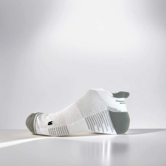 Low cut white and grey tennis socks with moisture-wicking and anti-odor properties.