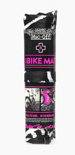 Load image into Gallery viewer, Foldable Muc-Off Bike Mat for indoor maintenance and travel.