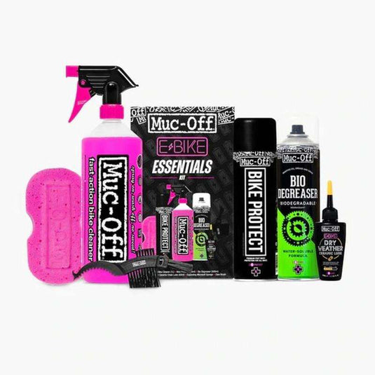 Muc-Off eBike Essentials Kit with cleaner, protectant, degreaser, lube, sponge, and brush for bike maintenance.