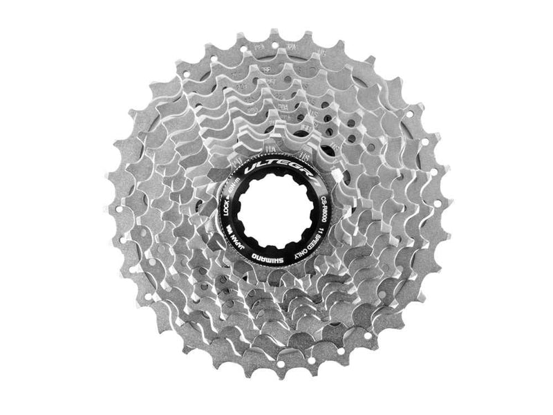 Chargez l&#39;image dans la visionneuse de la galerie, SHIMANO Cassette Ultegra CS-R8000 11-speed 11-32T with distinctive black and anthracite design, featuring high switching performance and wear resistance.
